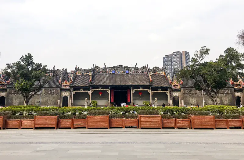 Chen Clan Ancestral Hall: the long grey-brick facade with ornate ridge decorations, seen across the forecourt