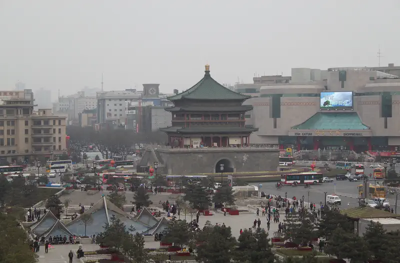 Drum Tower and Bell Tower: tiered tower overlooking a busy city plaza with traffic