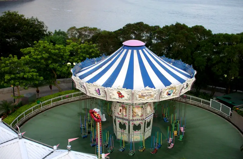 Hong Kong Ocean Park: aerial view of a carousel ride with a striped canopy