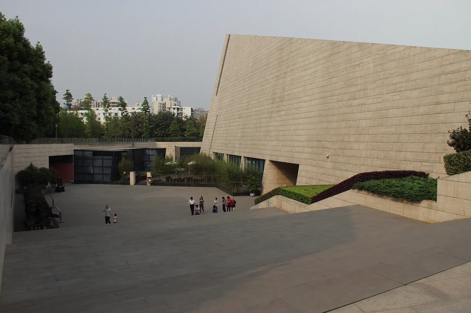 Jinsha Site Museum: the sloping stone-clad museum building beside a paved plaza