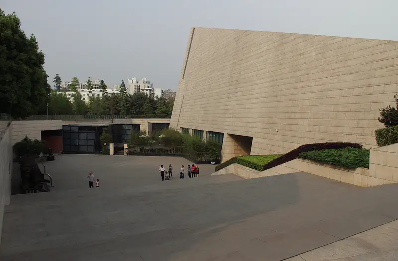 Jinsha Site Museum: the sloping stone-clad museum building beside a paved plaza