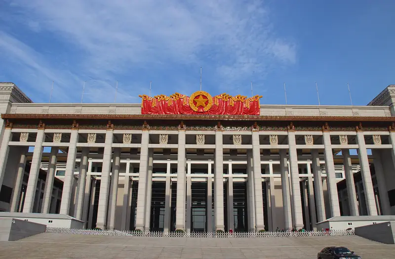 National Museum of China: large neoclassical building facade with rows of columns under a clear blue sky