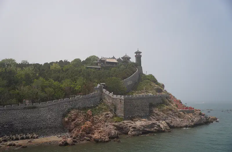 Penglai Pavilion: the walled clifftop complex above the sea, seen from the south-east