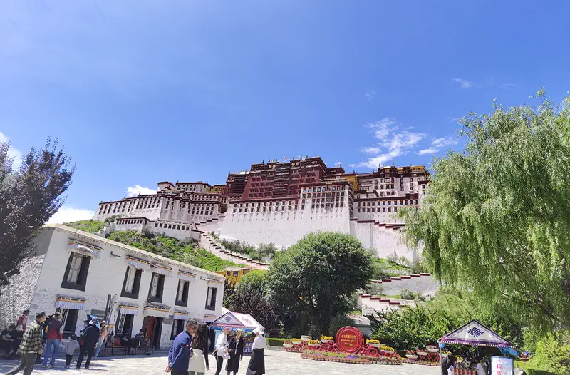 Potala Palace red and white fortress rising 13 storeys above Lhasa valley floor