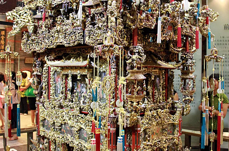 Shanghai History Museum: elaborate gold and silver ornamental structure with intricate carved detailing on display