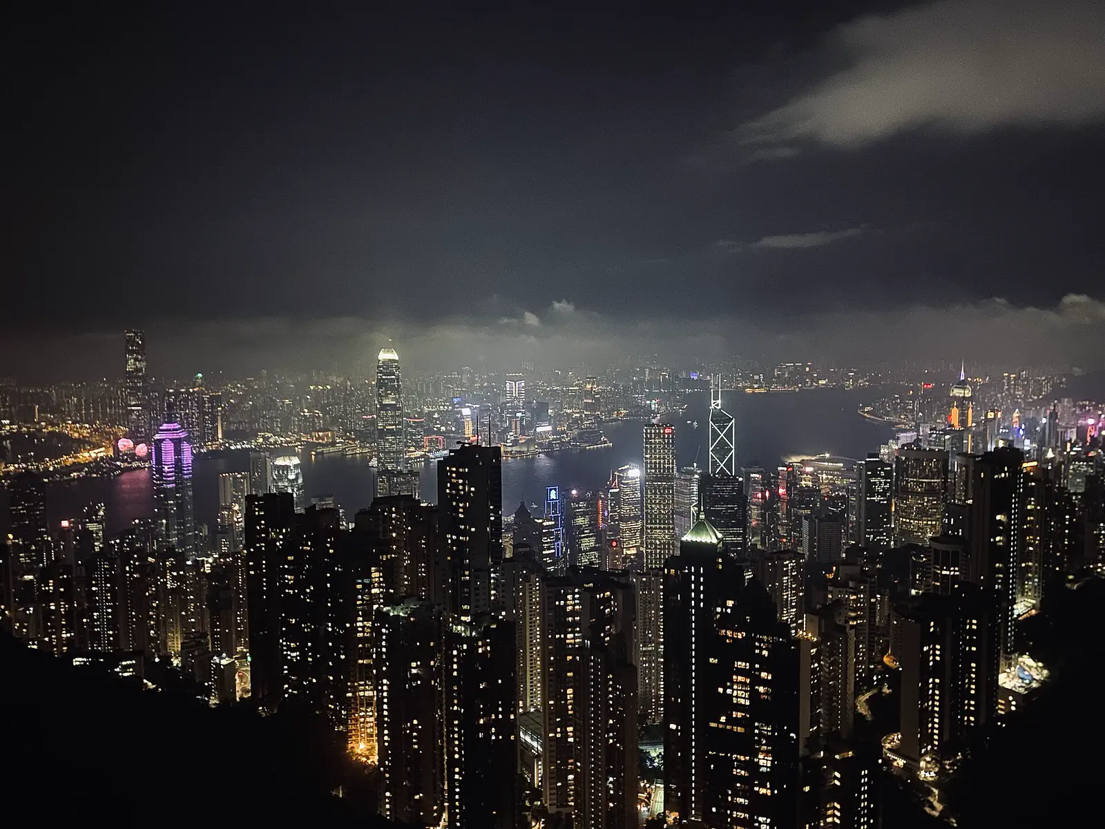 Victoria Peak: night view of Hong Kong's illuminated skyscraper skyline and harbour from a high vantage point