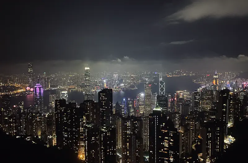 Victoria Peak: night view of Hong Kong's illuminated skyscraper skyline and harbour from a high vantage point