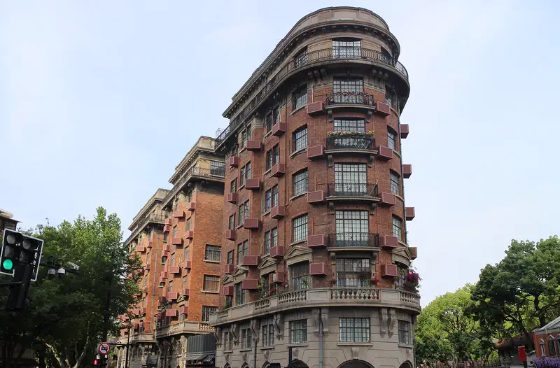 Wukang Mansion Shanghai Art Deco prow-shaped facade on Wukang Road tree-lined corner