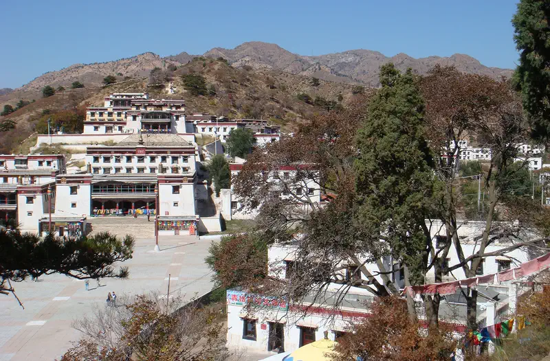Baotou: whitewashed Tibetan-style halls of the Wudangzhao lamasery spread across a wooded hillside