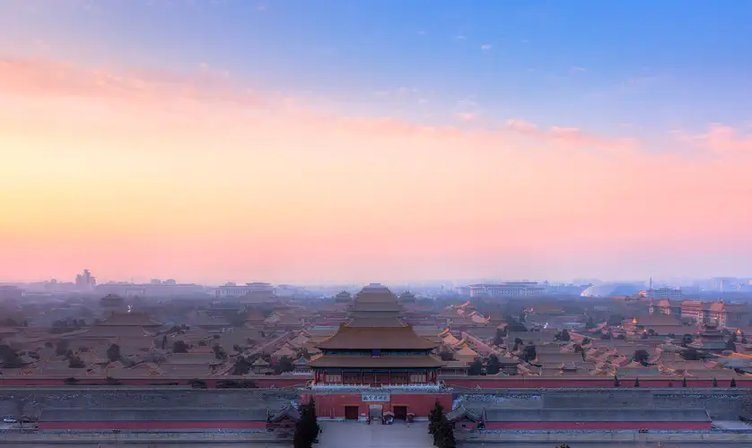 Beijing: the Forbidden City's yellow-tiled roofs seen from Jingshan Park at sunset