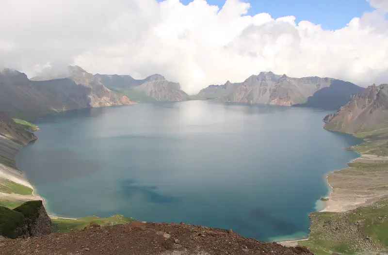 Changbaishan: the blue crater lake of Tianchi ringed by bare volcanic peaks