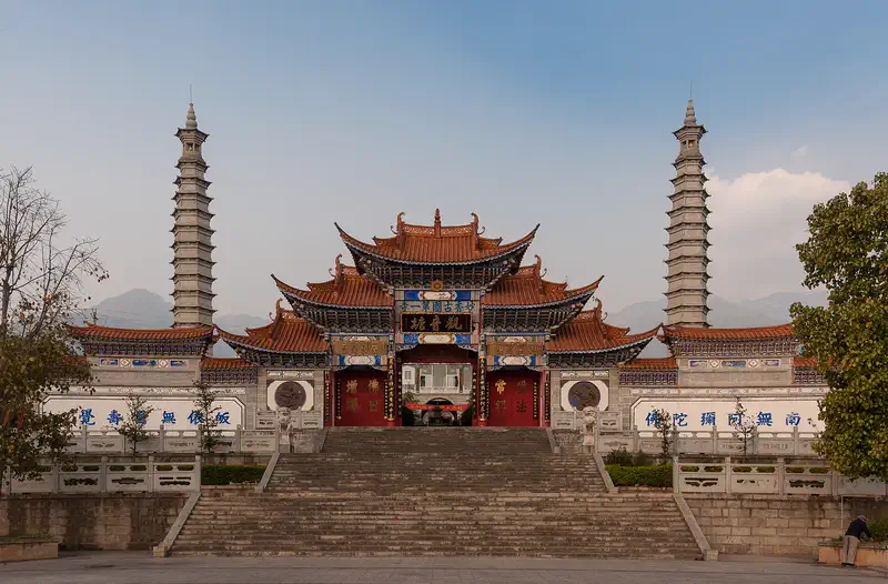 Dali: a temple gate flanked by two pagodas opposite the west gate of the old town walls