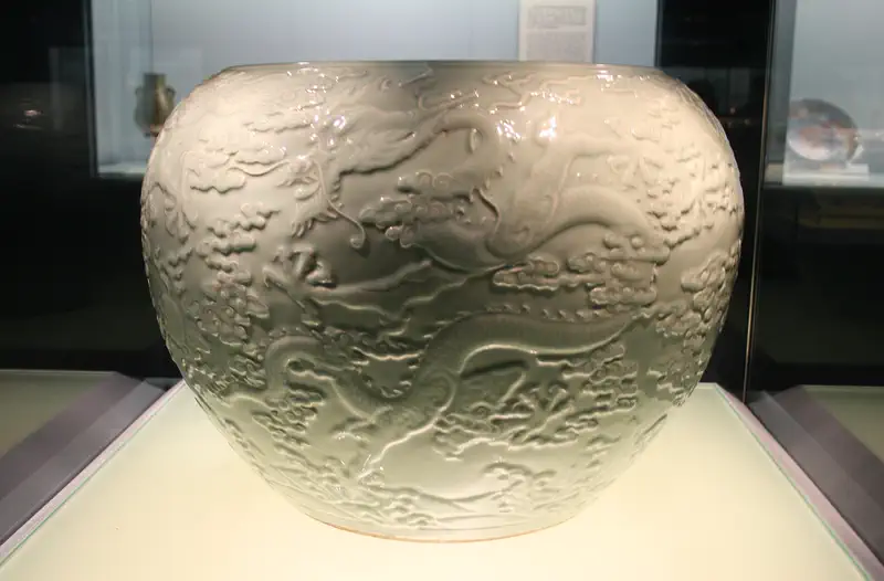 Jingdezhen: carved white porcelain vase displayed in a museum case