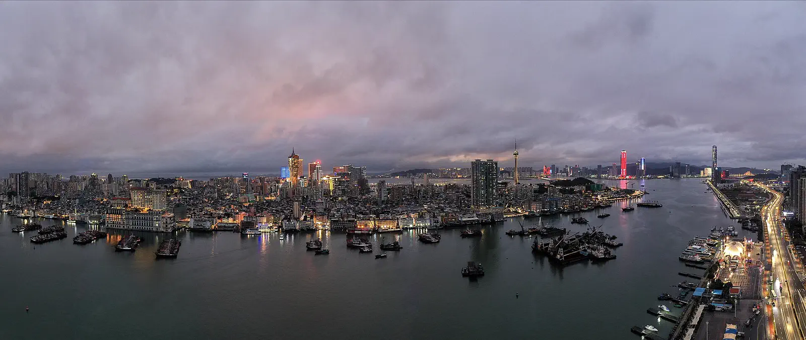 Macau: panorama of the west side of the Macau Peninsula across the water at dusk