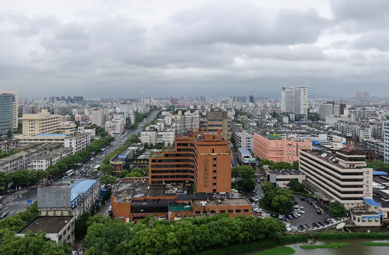 Ningbo: view across the city's mid-rise and high-rise buildings under an overcast sky