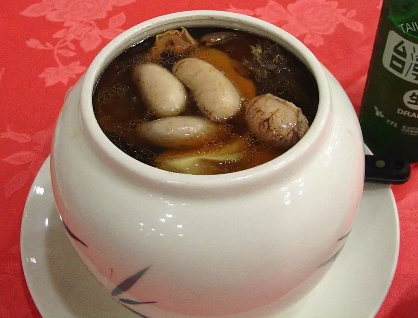Buddha Jumps Over the Wall: soup in a white ceramic pot with visible chunks of meat and vegetables