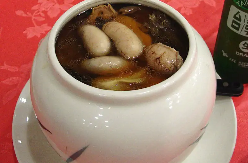 Buddha Jumps Over the Wall: soup in a white ceramic pot with visible chunks of meat and vegetables